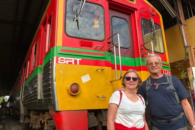 Amphawa and Railway Markets with Boat Ride Group Tour - Wat Bang Kung: banyan roots, Ayutthaya-era Buddha, and strong visuals
