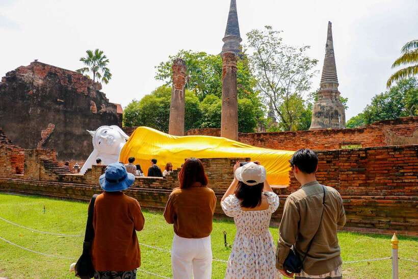 Ayutthaya One Day: Famous Temples & Bang Pa-In Palace Tour - Wat Yai Chai Mongkhon: chedi scale and rows of Buddha statues