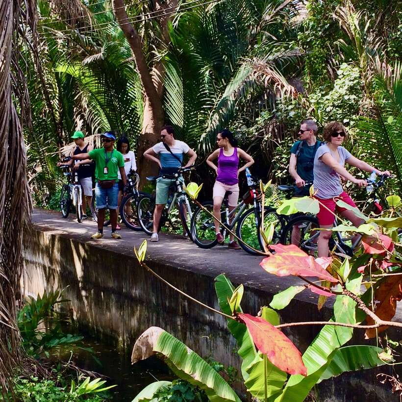 Bangkok green oasis guided bike tour with boat ride - Feeding fish and tasting simple roadside life