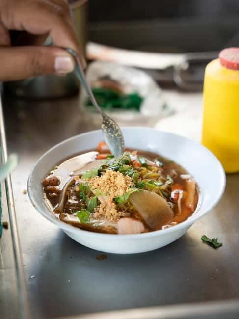 Bangkok: Must-Try Hidden Bike & Food Experience - Getting started at Must-Try Bangkok and the riverside Tsai Eatery