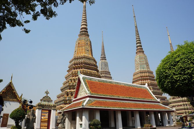 Bangkok’s Sacred Temples & Local Culture Half-Day Tour - Wat Benchamabophit’s White Marble Facade and Elegant Rooflines