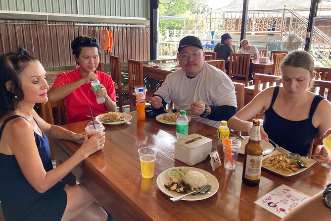 Damnoen Saduak and Maeklong Railway Market Tour with Private Car - Damnoen Saduak by paddle boat: canals, snacks, and slow time