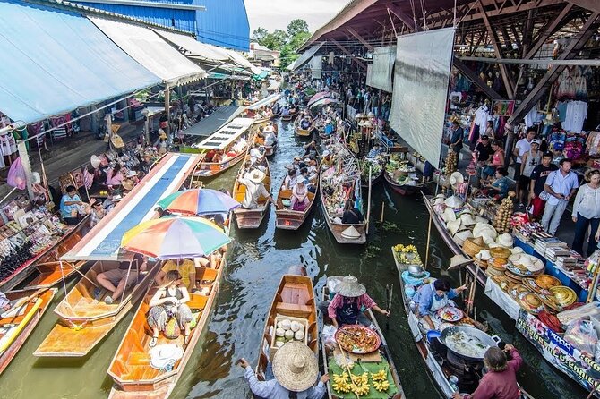 Full-Day Floating Market and Maeklong Railway Market Private Tour from Bangkok - Wat Bang Kung and the banyan roots that shape the whole scene