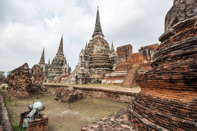 Lopburi Monkey Temple & Ayutthaya Old City Tour From Bangkok - Wat Mahathat: The Tree Roots Moment and the Ruins That Feel Human