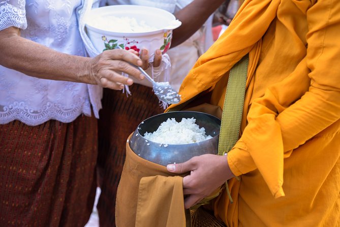 Morning Buddhist Almsgiving, Grand Palace and Flower Market Tour in Bangkok - Morning almsgiving at a local monastery, not a staged show
