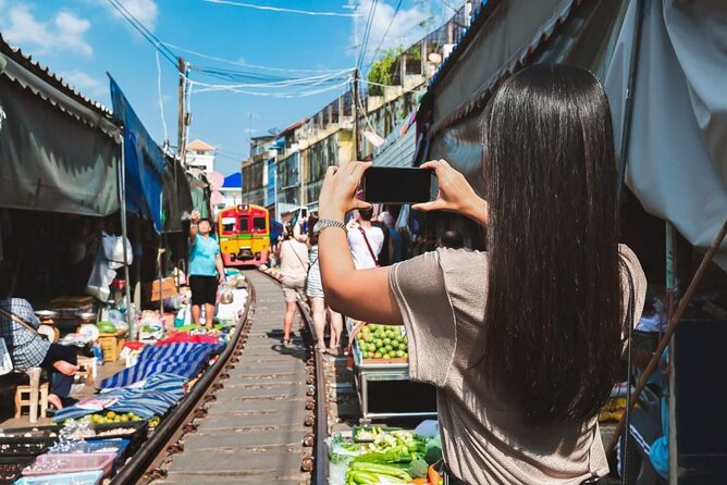 Private Damnoen Saduak and Maeklong Railway Market Tour(min 2pax) - Entering Maeklong Railway Market, where stalls react to the train